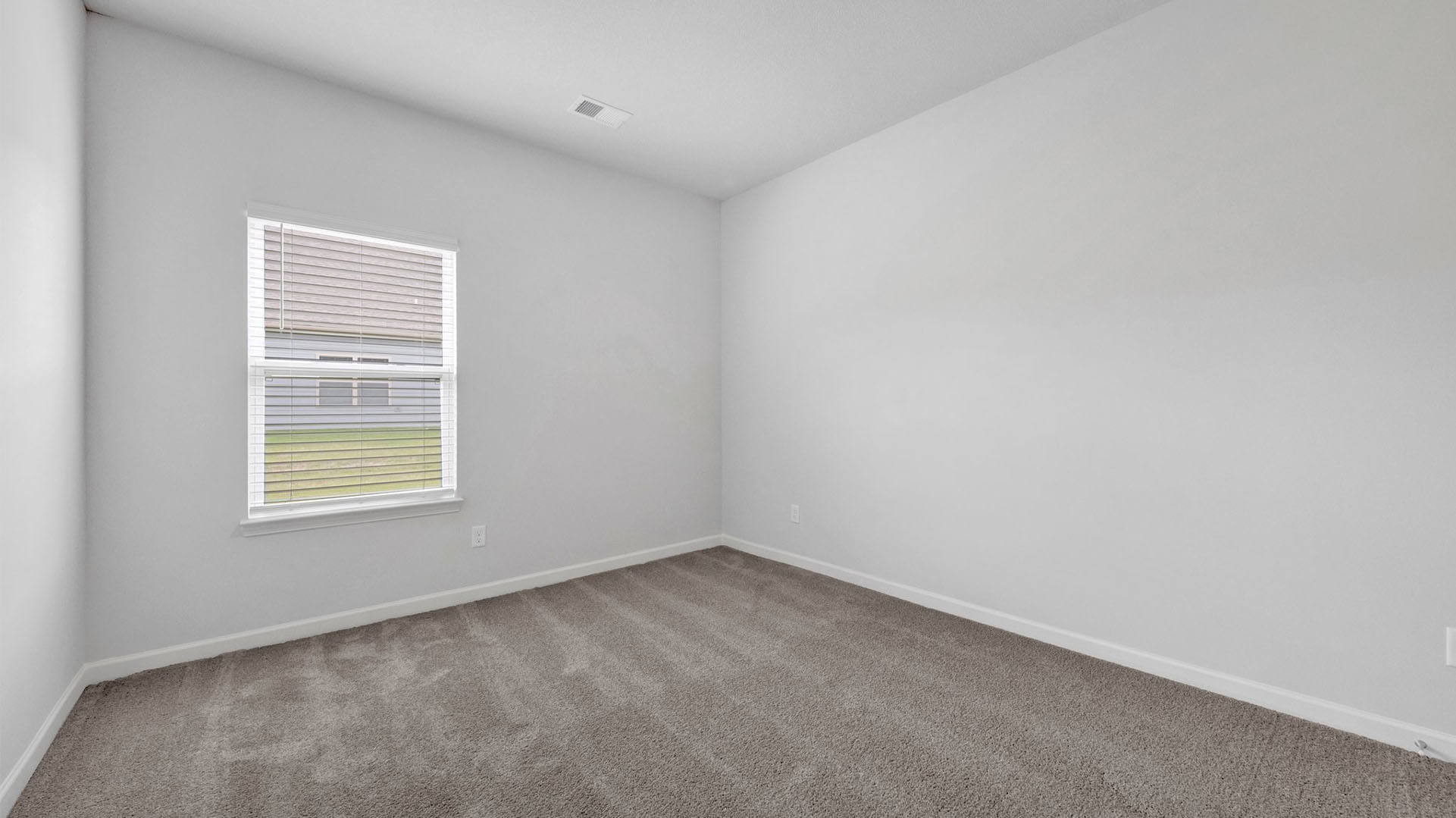 Fourth bedroom with a window for natural light