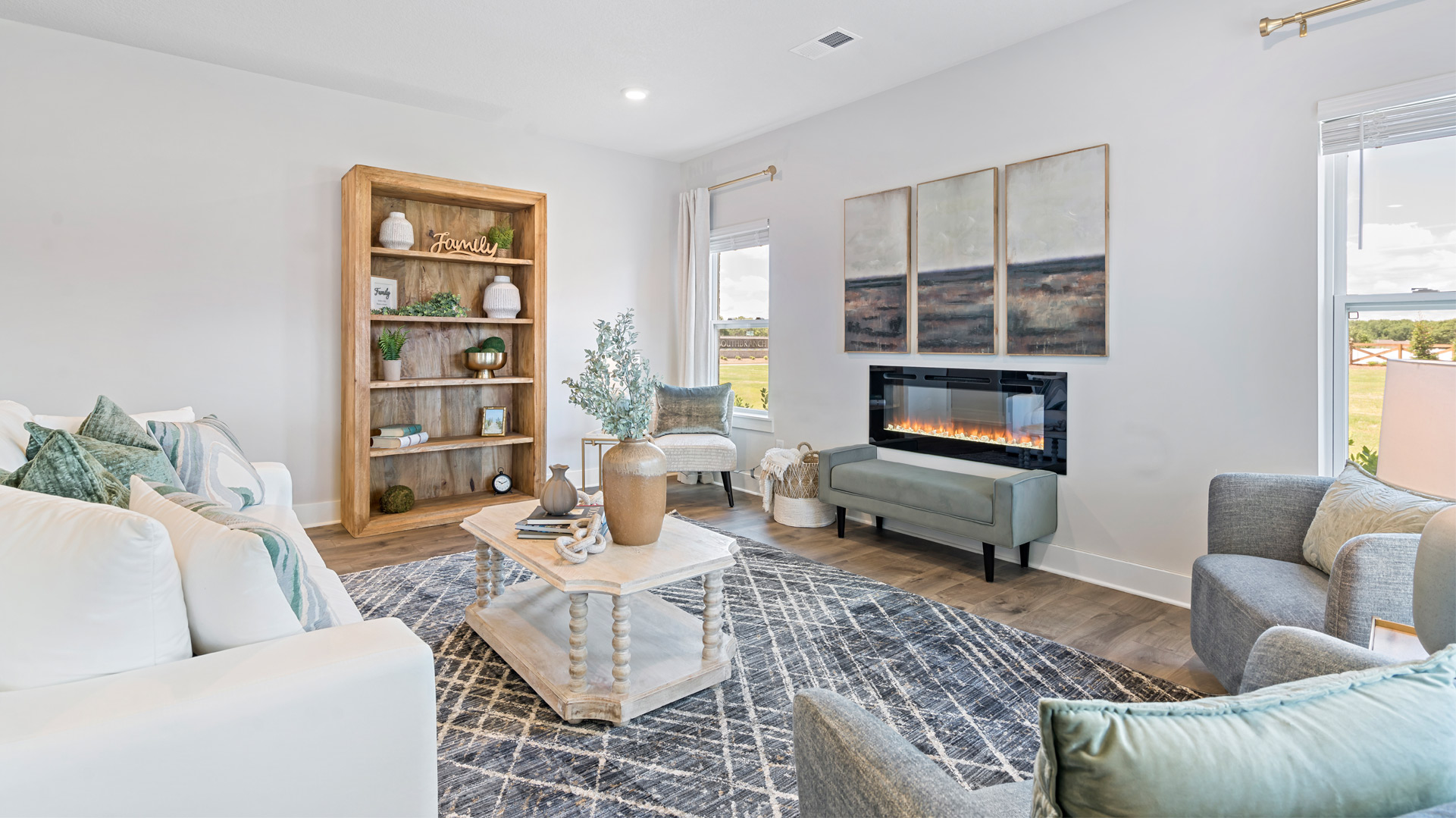 Living room with vinyl flooring and neutral paint