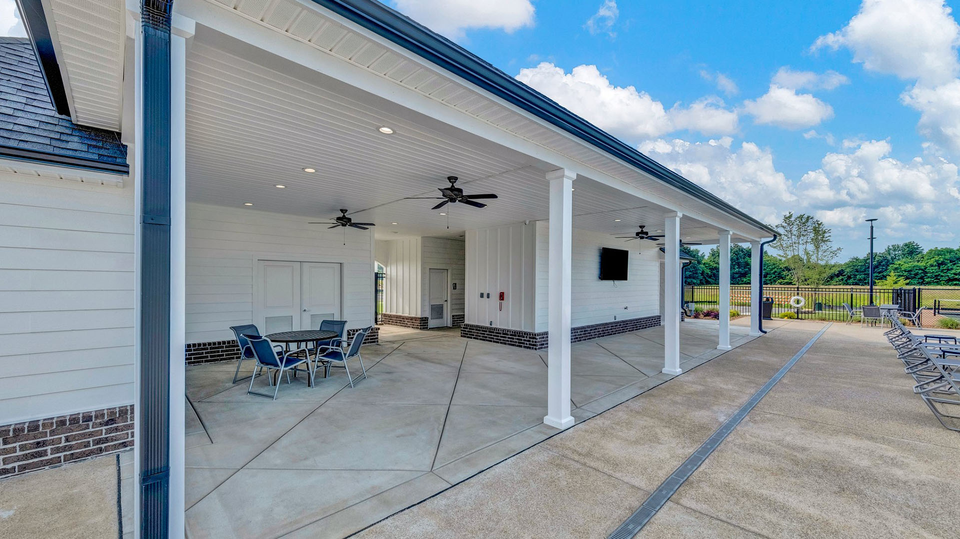 Interior of the pool house with fans, bathrooms and extra seating