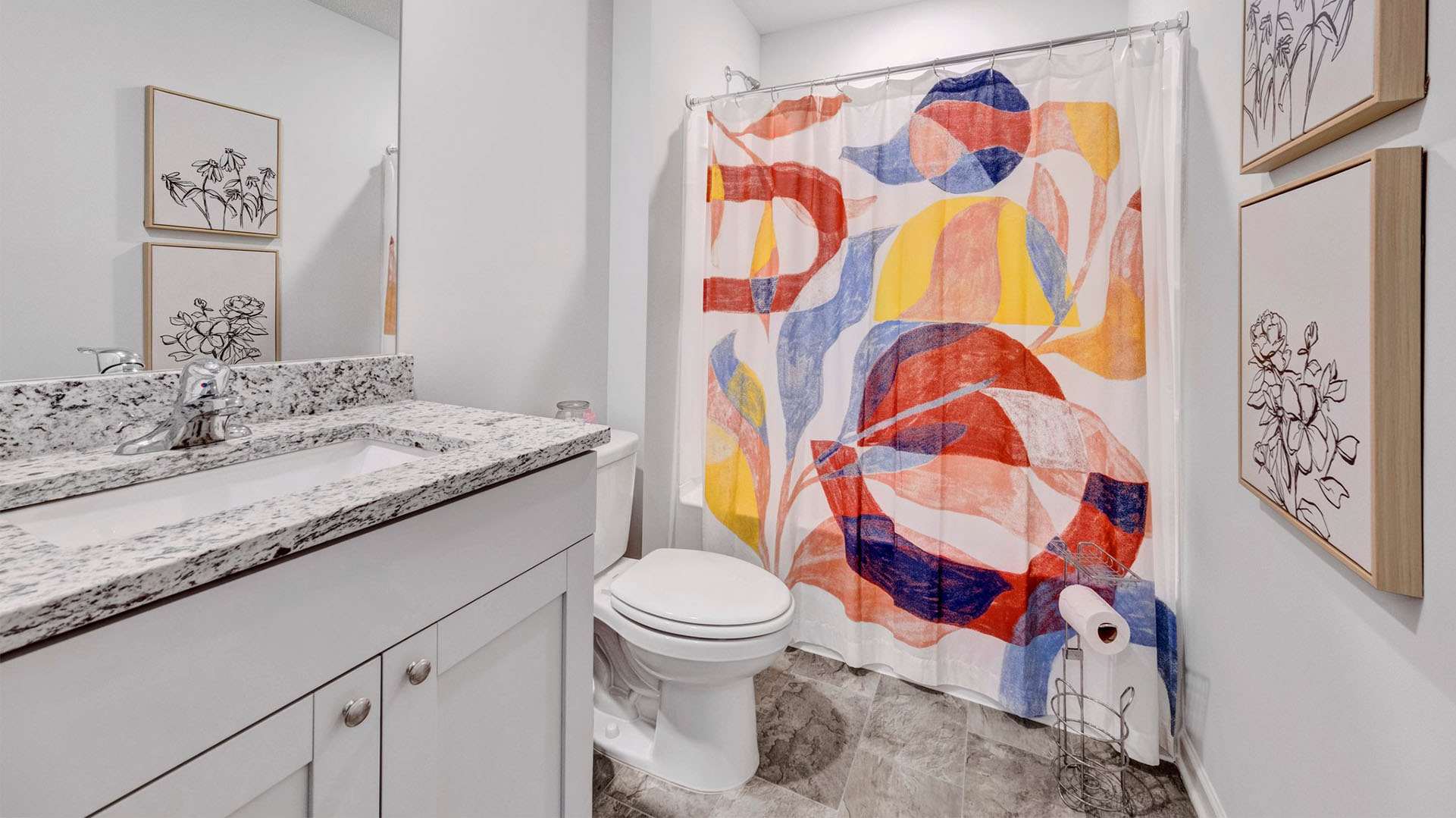 Guest bathroom with a single vanity and an acrylic tub/shower insert