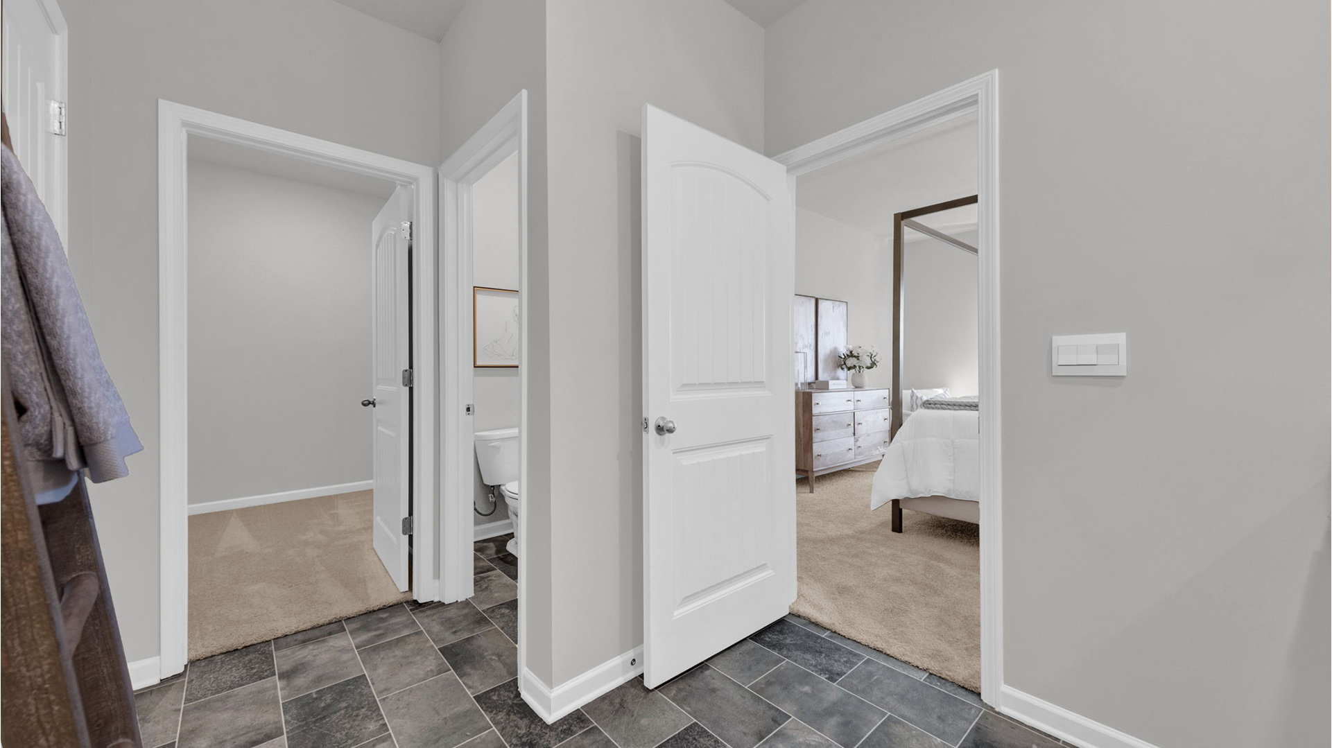 En suite with closet attached with ventilated shelving