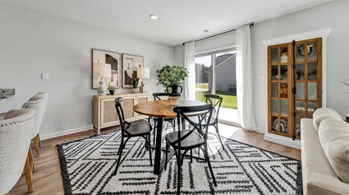 Dining area with close access to the glass sliding door out to patio