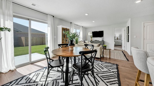 Open concept view of dining room overlooking the living room
