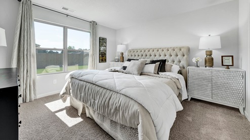 Beautiful primary bedroom placed in the rear back corner of the house for optimal privacy