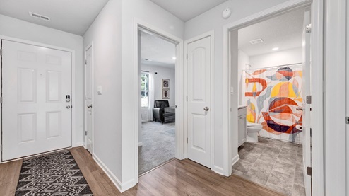 Foyer at the entrance of the home leading into the secondary bedroom