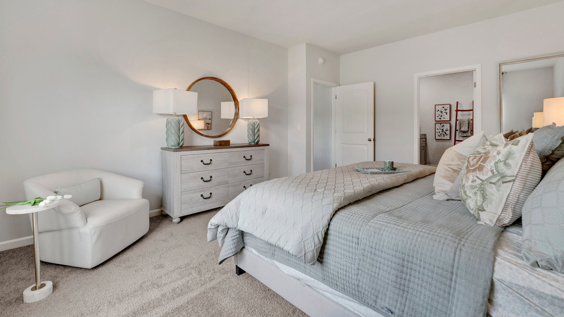 dover plan primary bedroom with 9 foot ceilings and carpet flooring in the orchard community