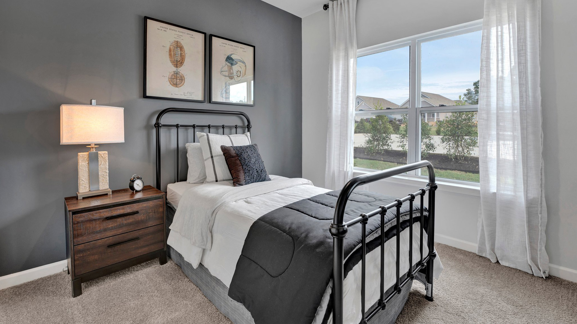 dover plan second bedroom with 9 foot ceilings, carpet flooring, and double-window allowing in natural light in the orchard community