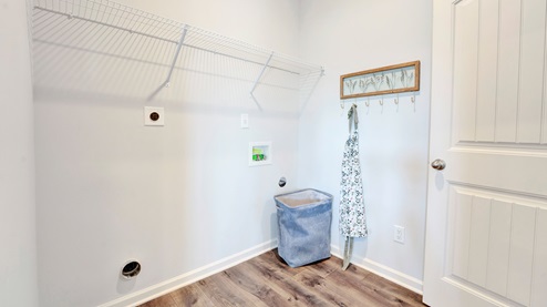 Laundry room with ventilated shelving