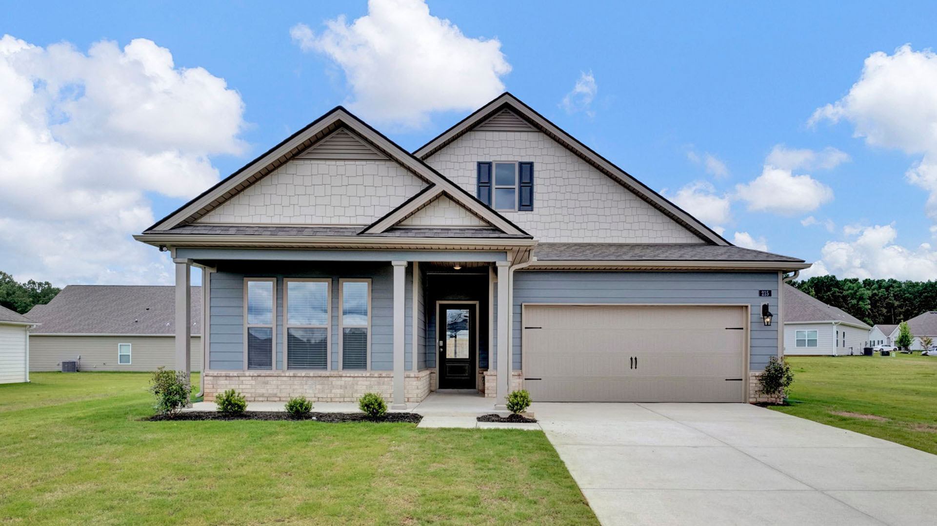 Exterior elevation of the CLifton a single story home with a two car garage
