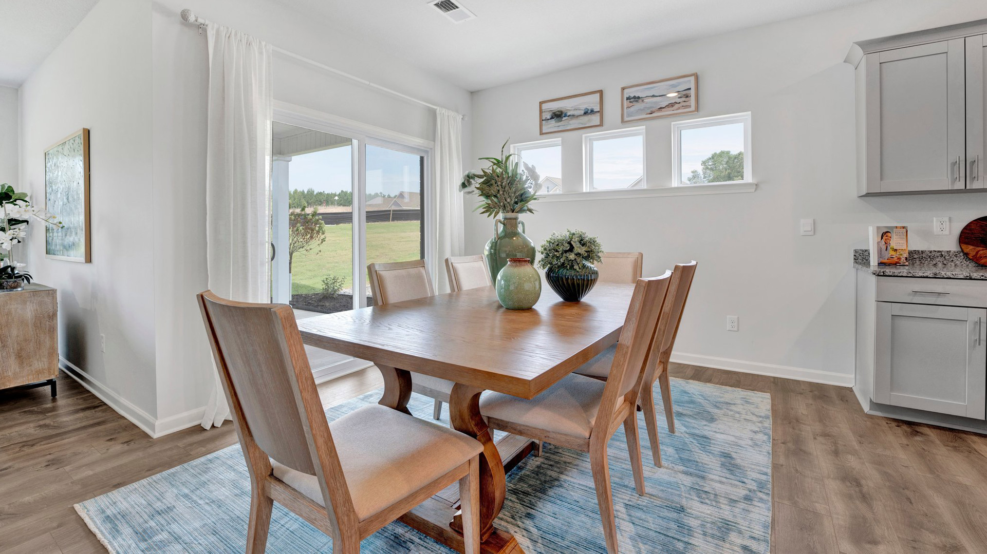 Dining room with picture accent windows for natural light