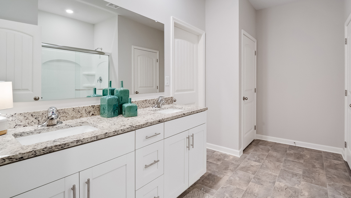 lacombe floorplan in indian oaks community en-suite primary bathroom with double vanity