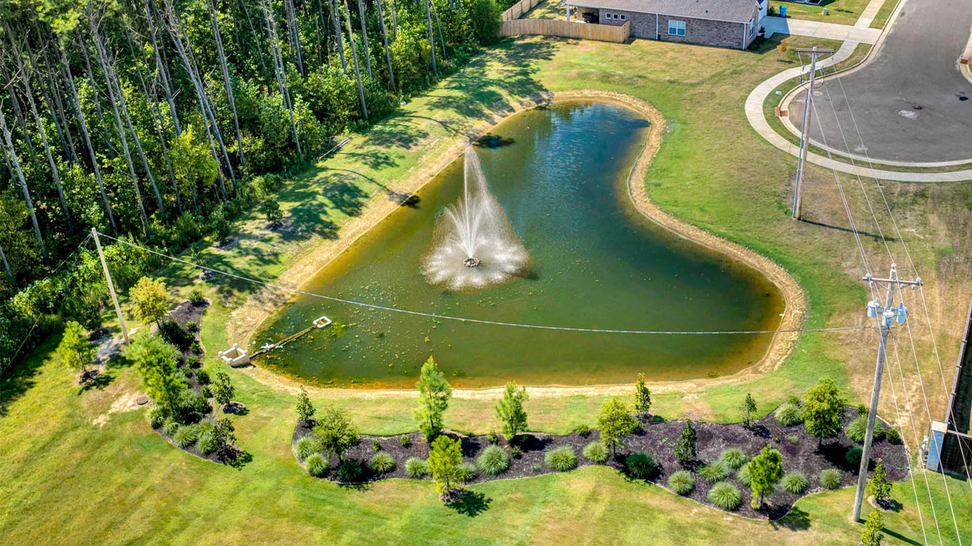 The indian oaks community pond with landscaping surrounding