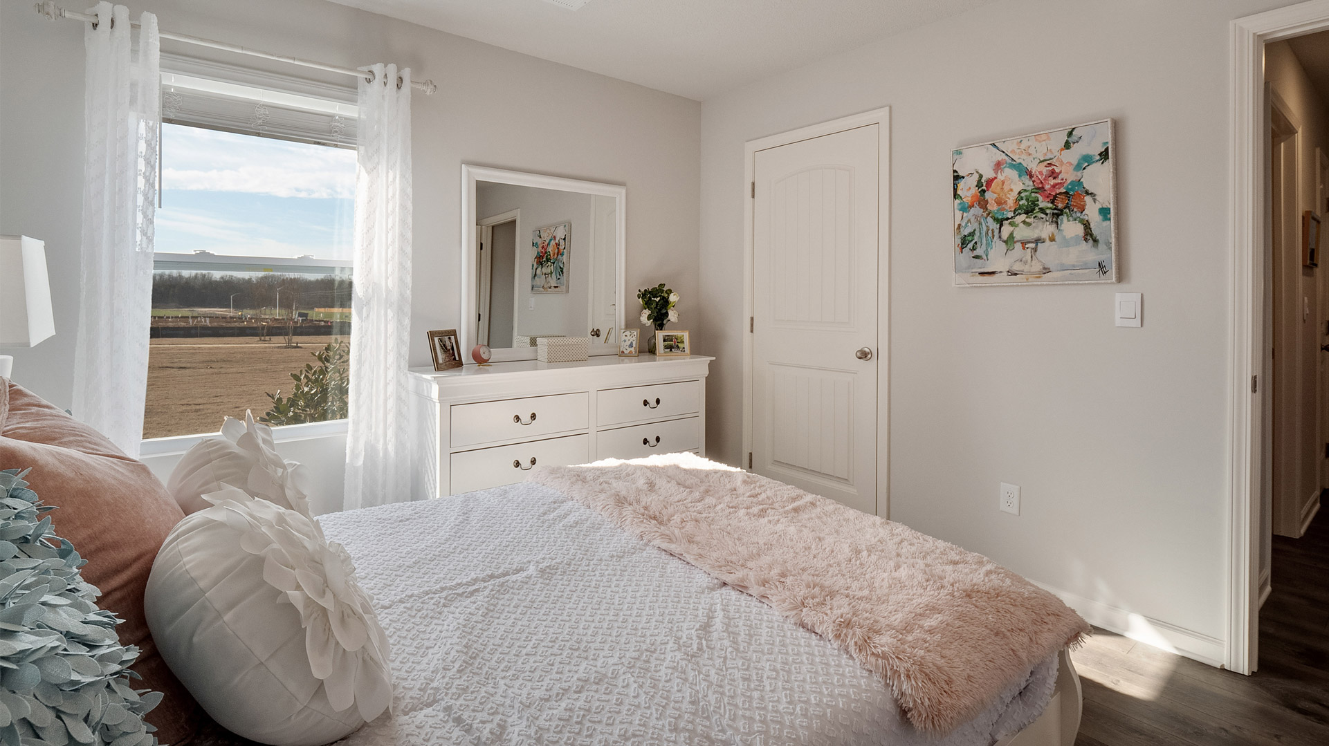 Guest bedroom 1 comfortably fitting a queen size bed
