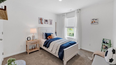 Second bedroom with carpet flooring
