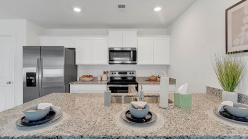 Mitchell kitchen area with light cabinets