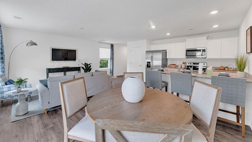Open concept view of the dining area overlooking the other main living areas