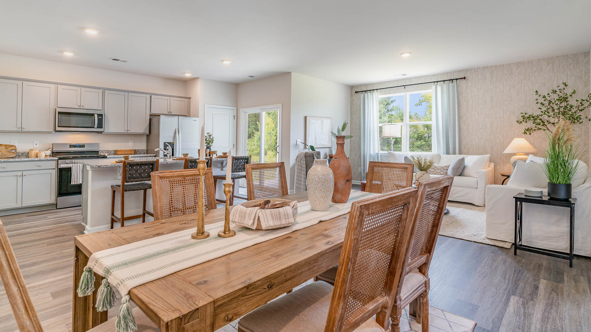 Dining room opens up at the end of long entry hall