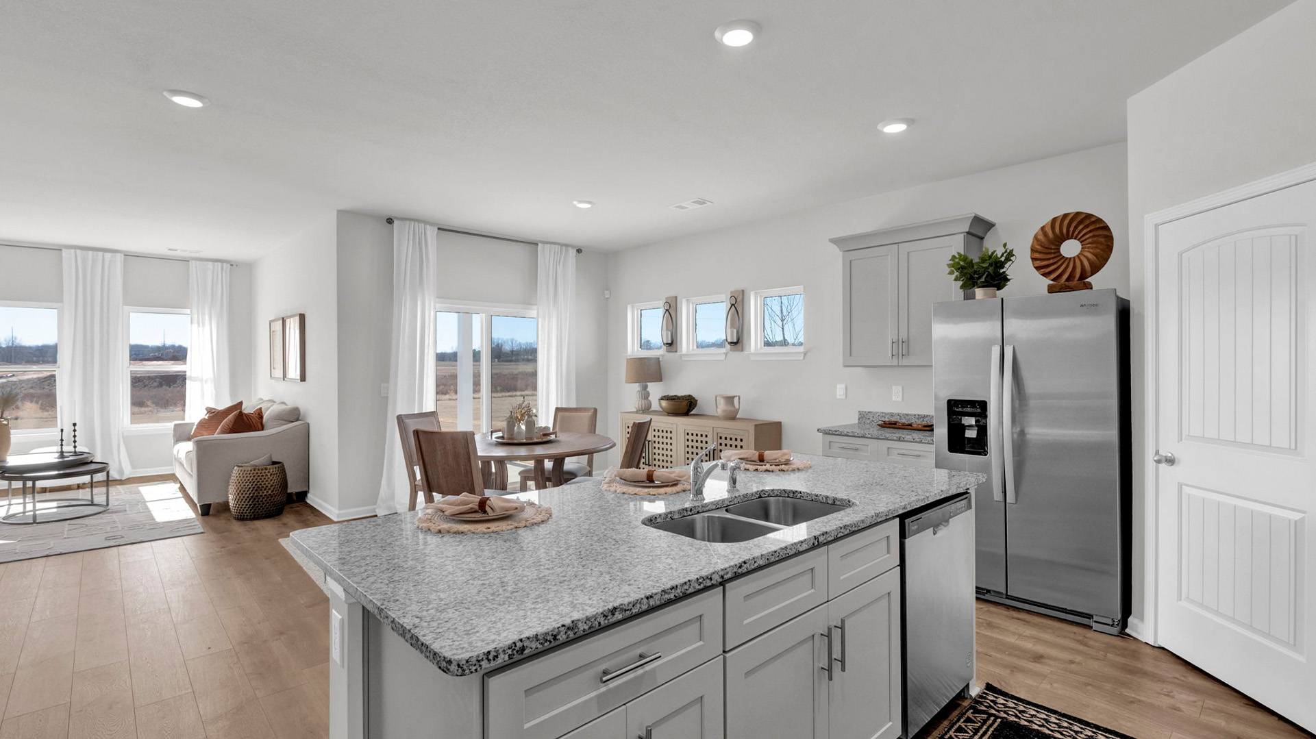 Open concept view of the main living areas open to one another