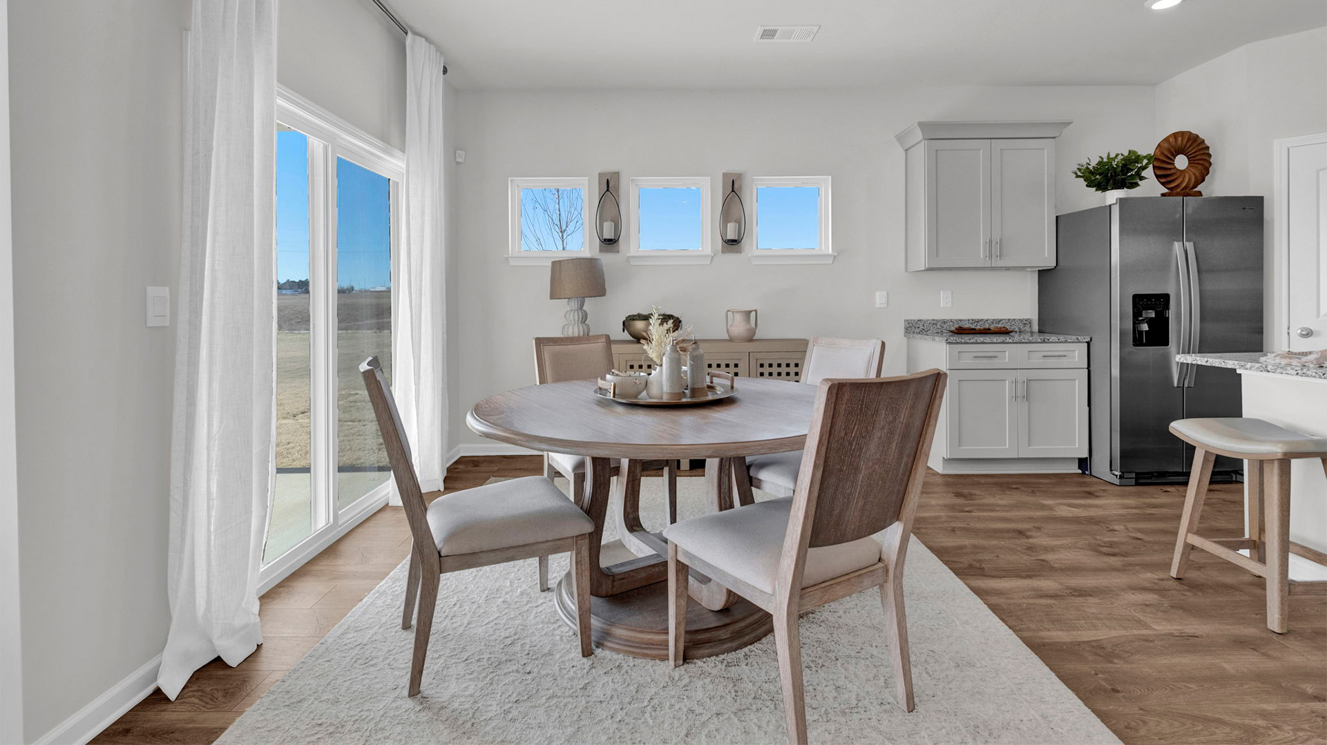 DIning area with picture window accents for natural light
