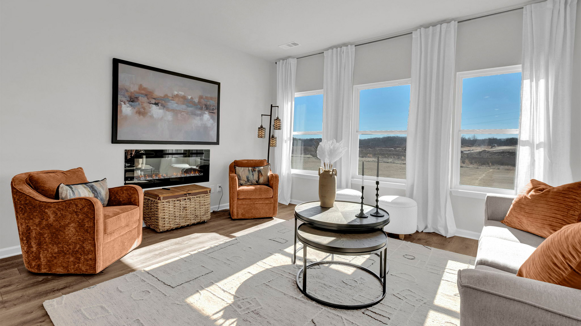 Spacious living room with vinyl flooring and neutral paint