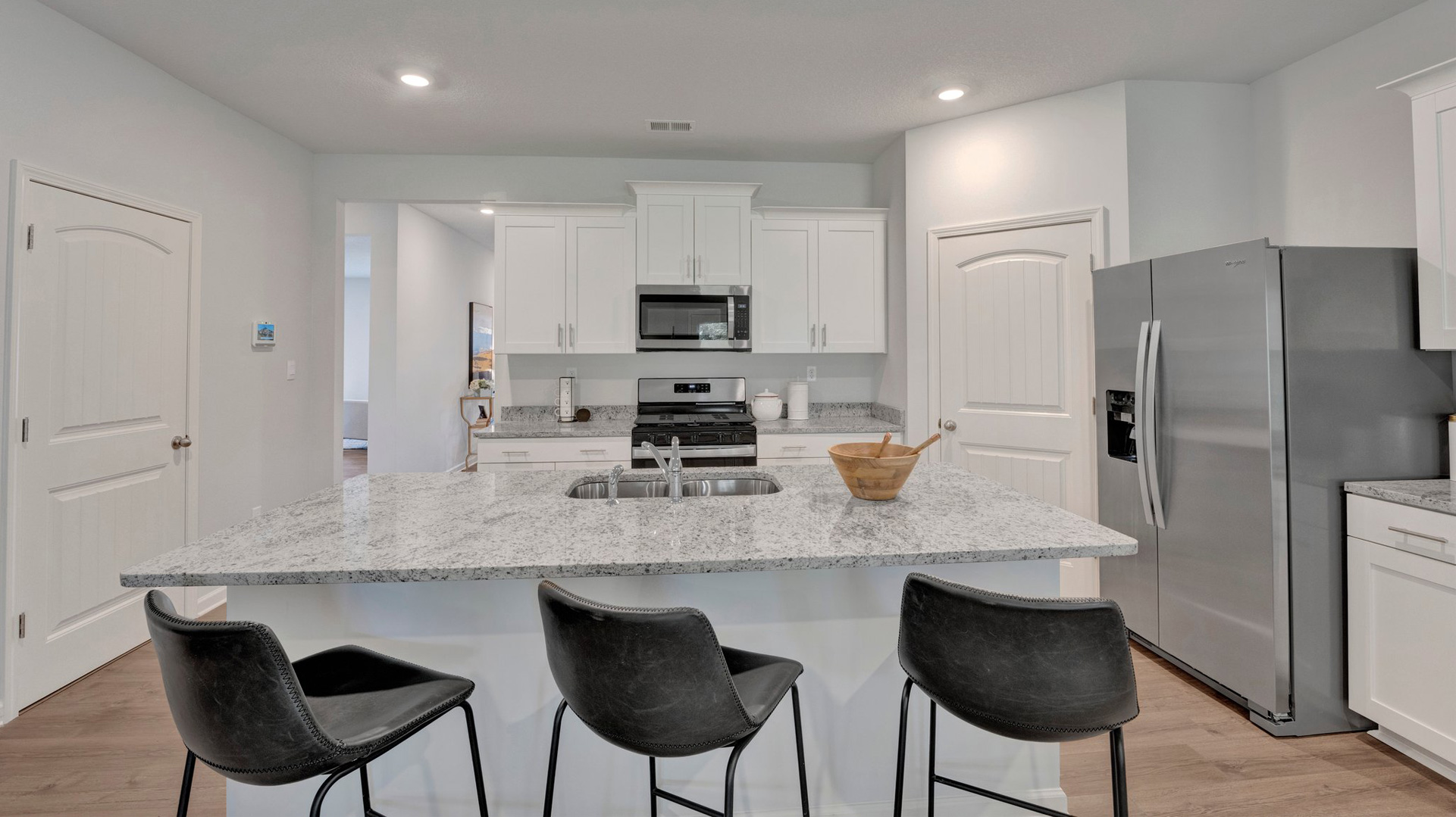 Beautiful kitchen area with bright recessed lighting