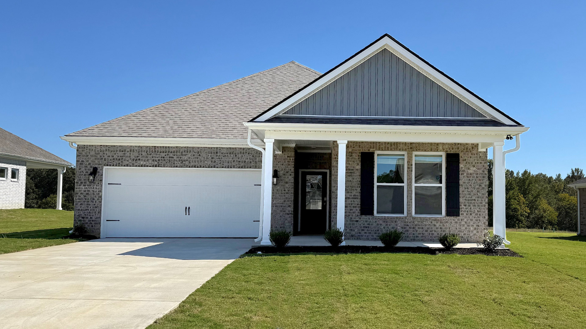 Exterior elevation of the Cameron floorplan, a single story home with a two car garage