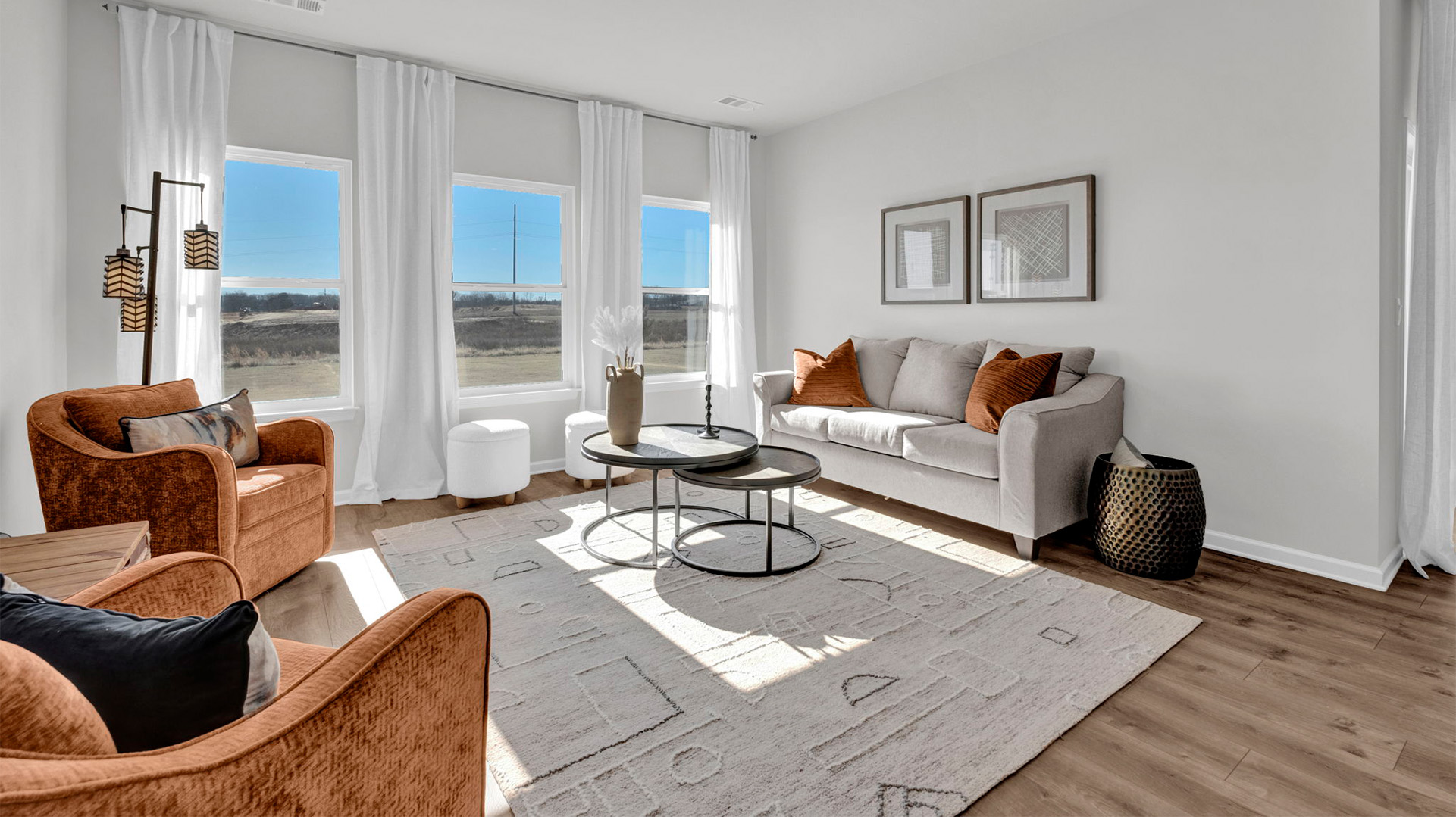 Living room with vinyl flooring and neutral paint