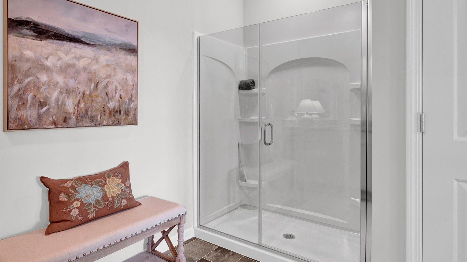 Glass enclosed walk in shower in the primary