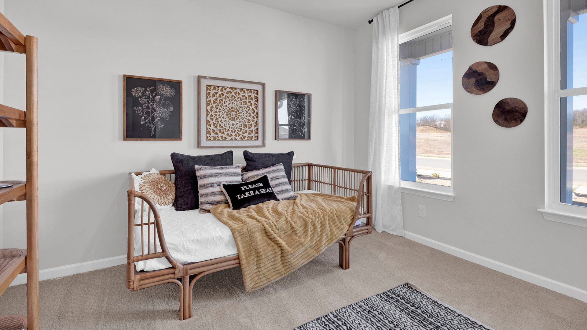 Second bedroom with a double window overlooking the front yard