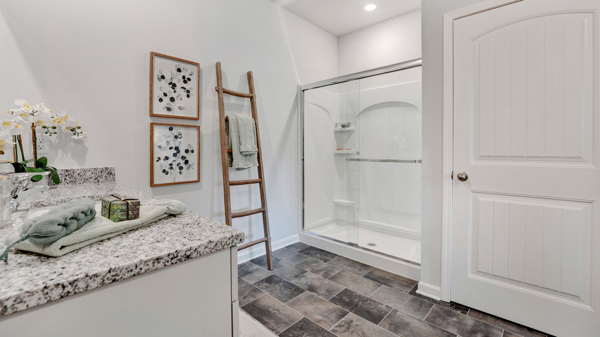 Primary bathroom with a glass enclosed walk in shower
