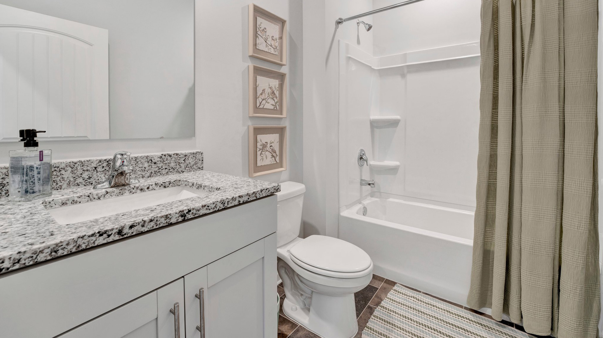 Second bathroom with a single vanity and an acrylic tub/shower insert
