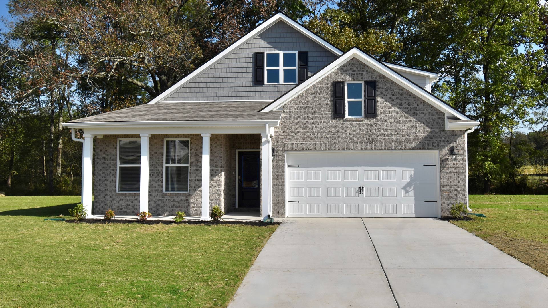 Exterior elevation of the dover floorplan, a single story home with a two car garage
