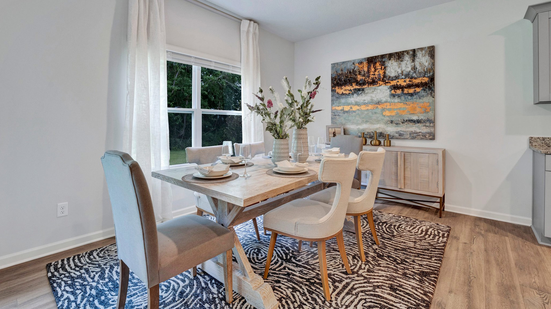 Dining room with a double window overlooking the backyard