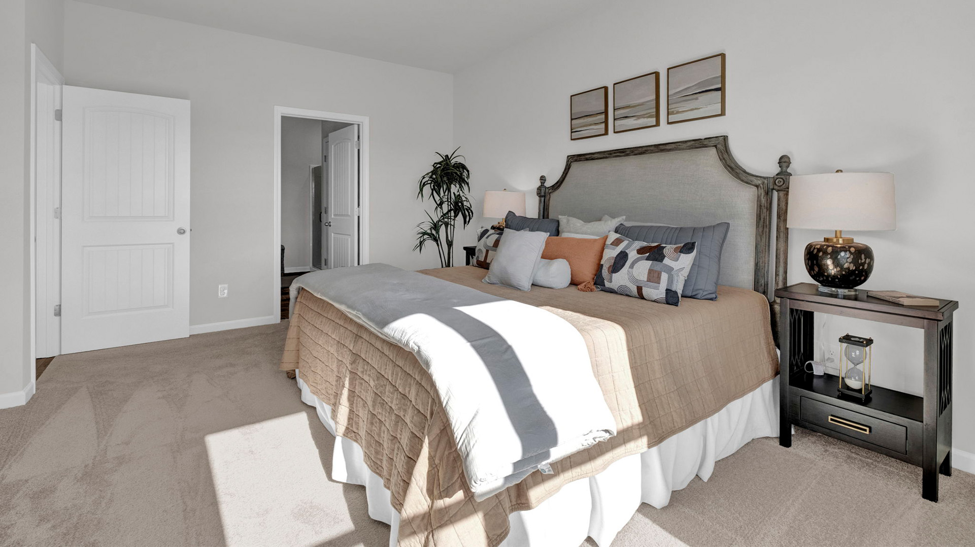 Primary bedroom with carpet flooring and neutral paint