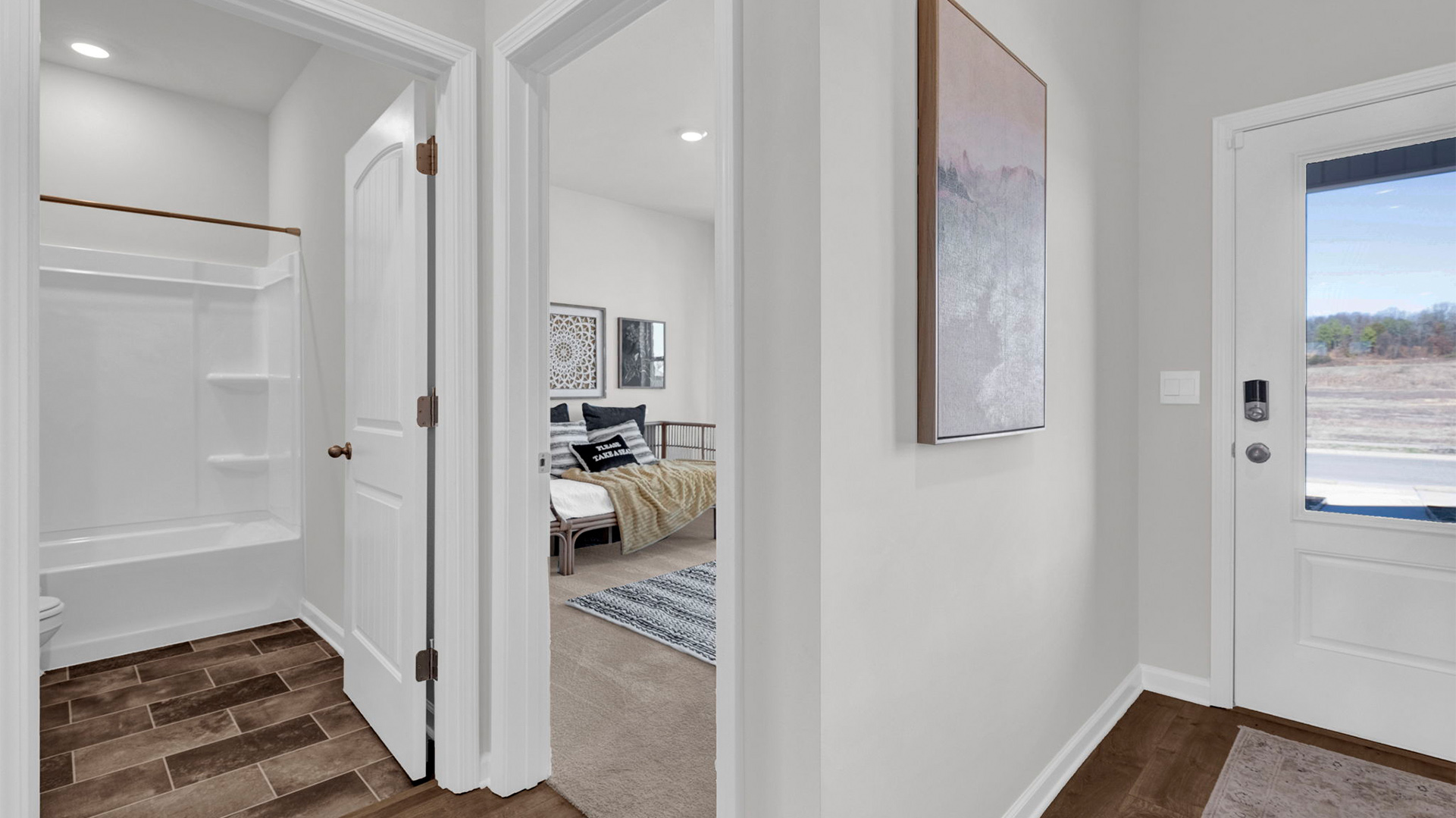 ENtry foyer leading into the second bedroom at the front of the home