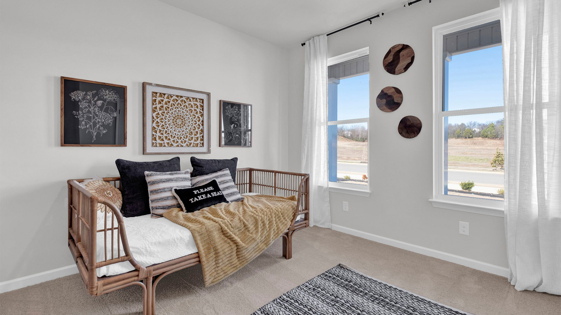 Bedroom 2 is located at the front of the home with a large window