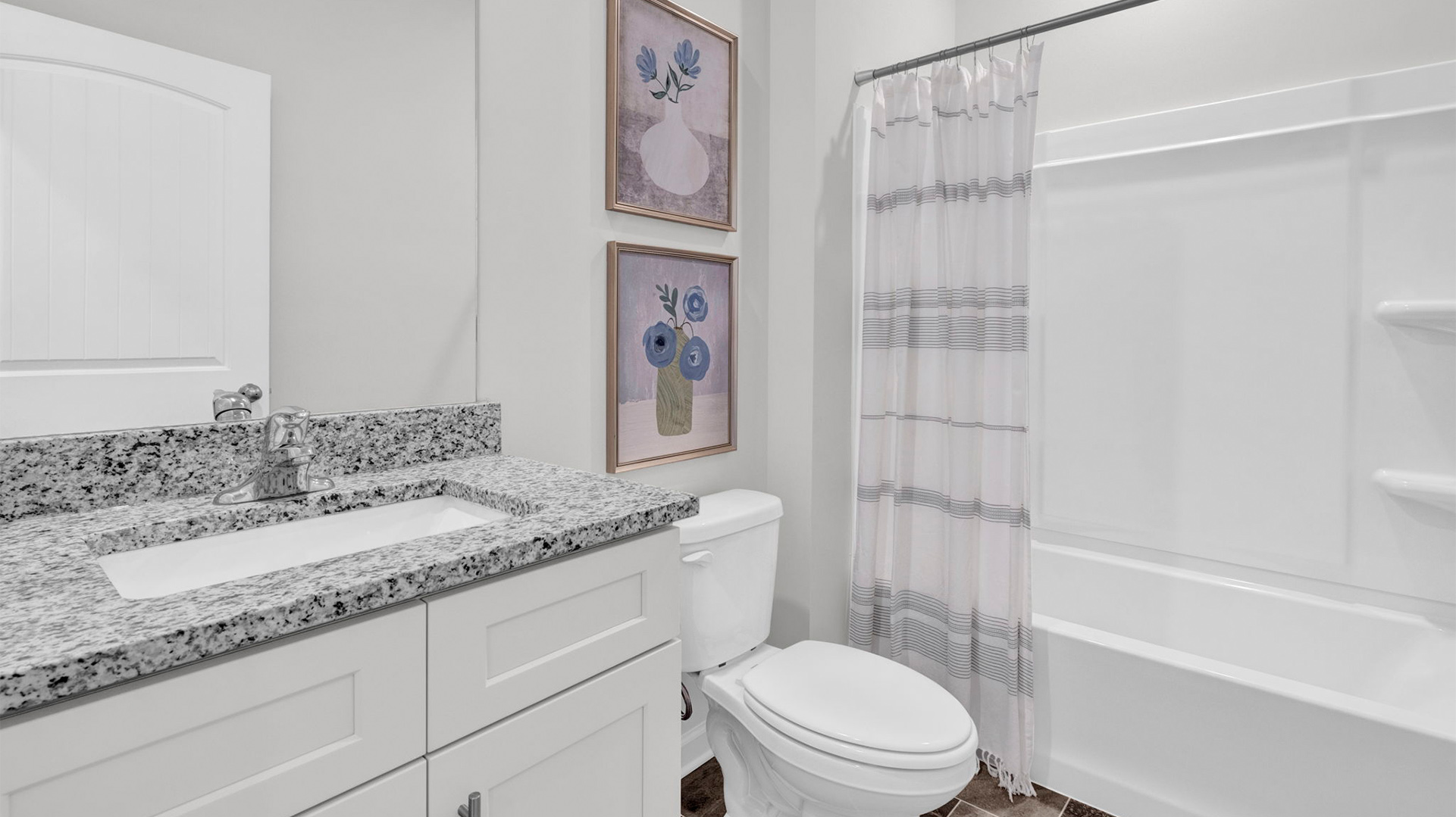 Second bathroom with a single vanity and an acrylic tub/shower insert