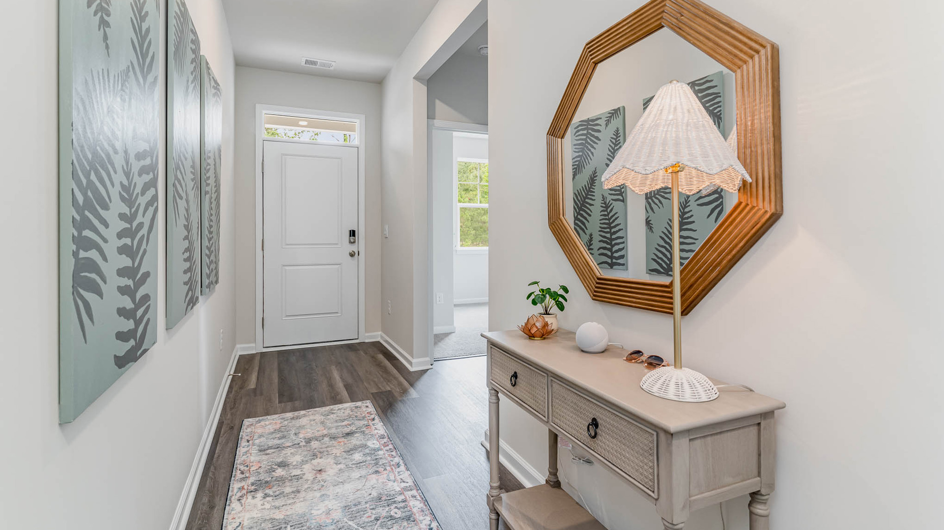 Front door entryway of the kenner floorplan leading into the secondary bedrooms