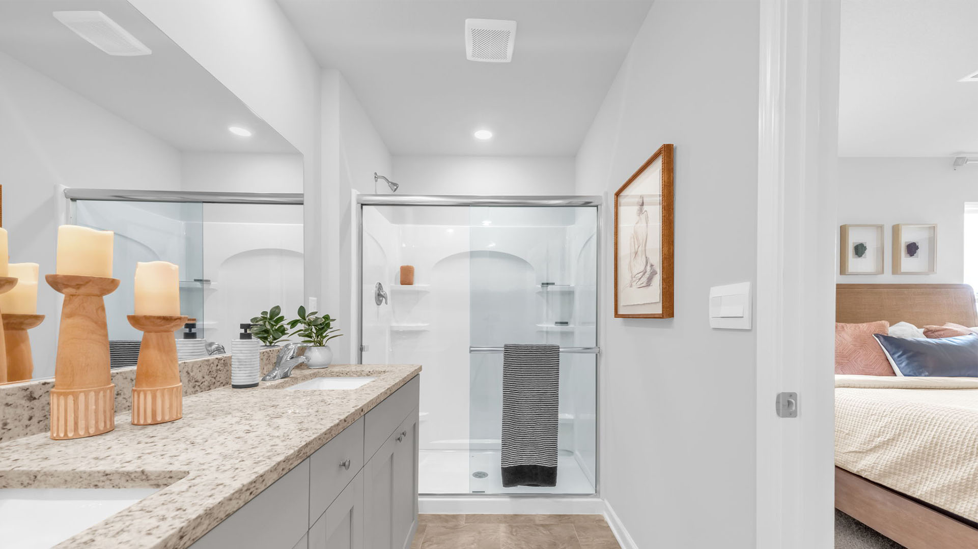 Glass enclosed walk in shower in the primary bathroom