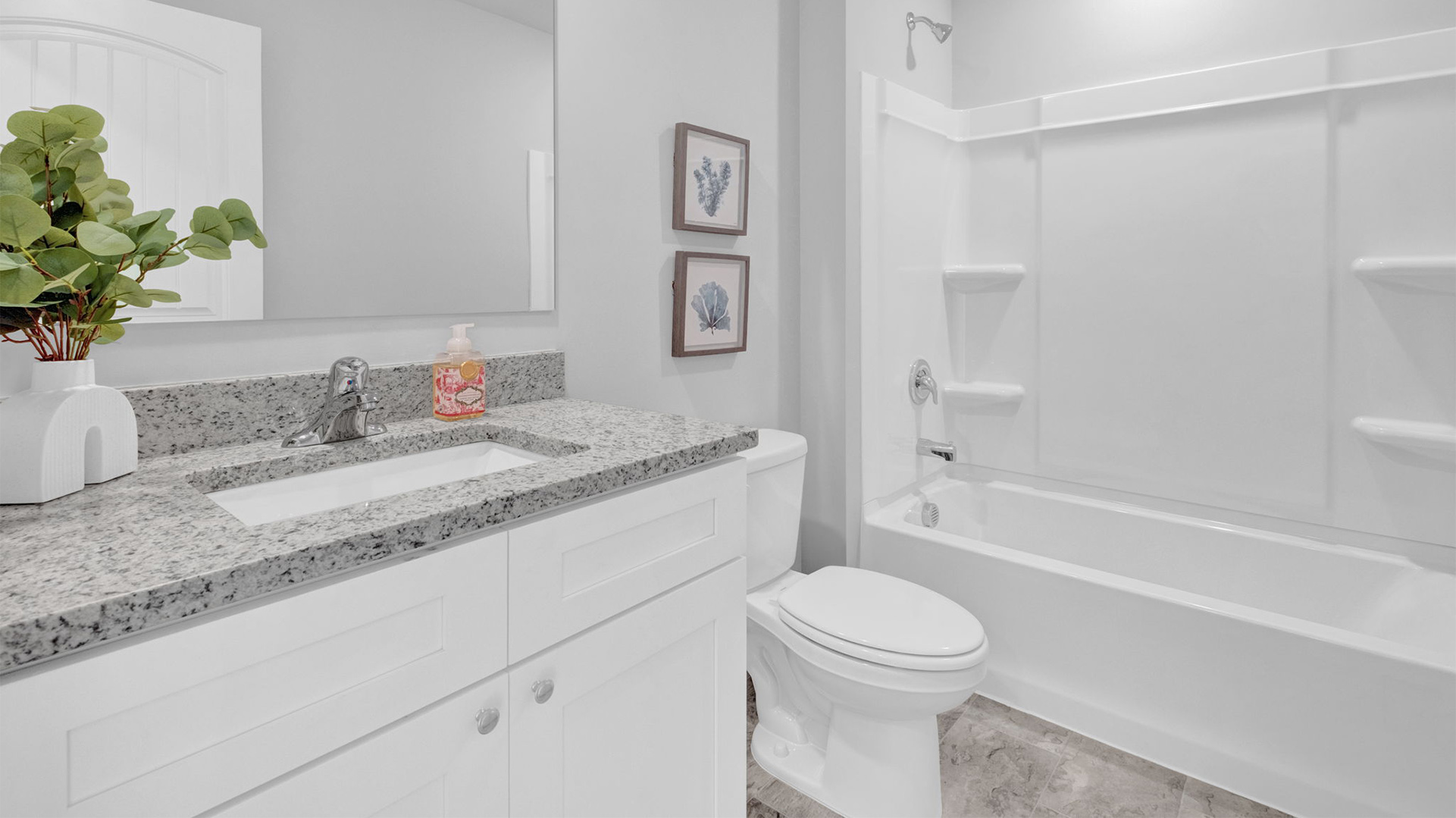 Second bathroom with a single granite top vanity
