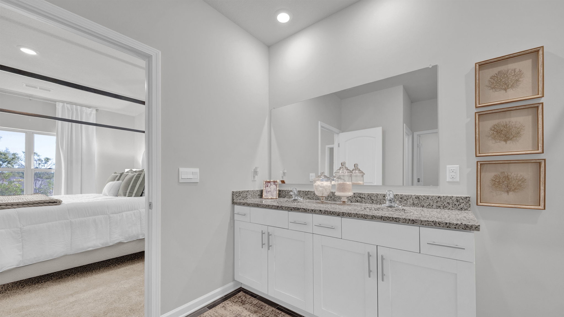 En suite bathroom with light cabinet vanity