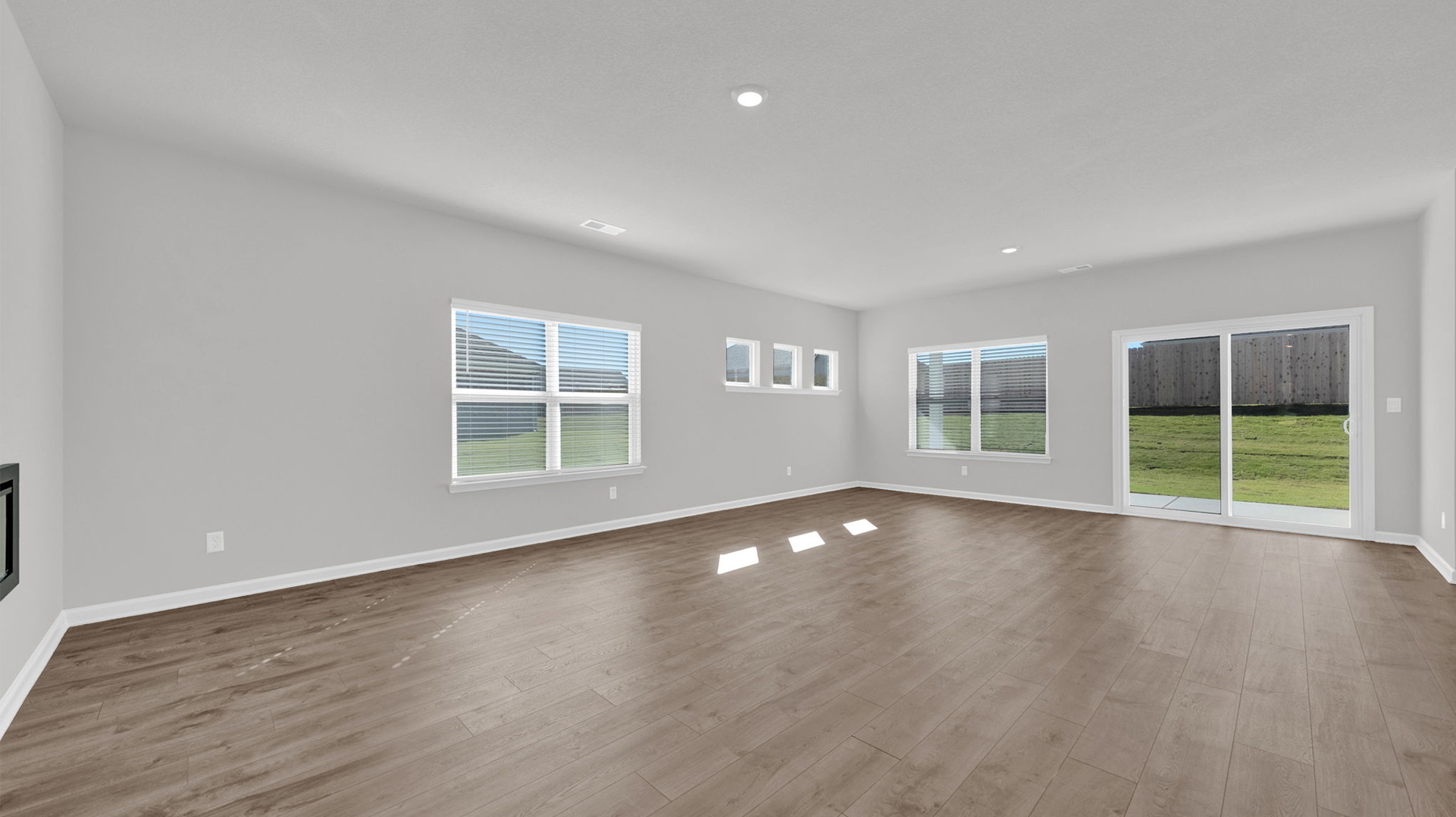 Open concept view of the living and dining room area open to one another