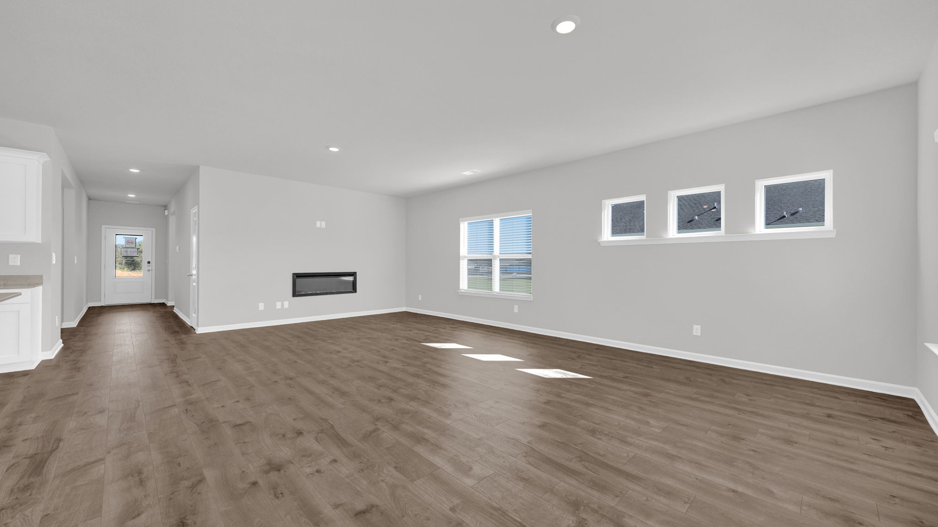 Open concept view of the dining and living room open to one another