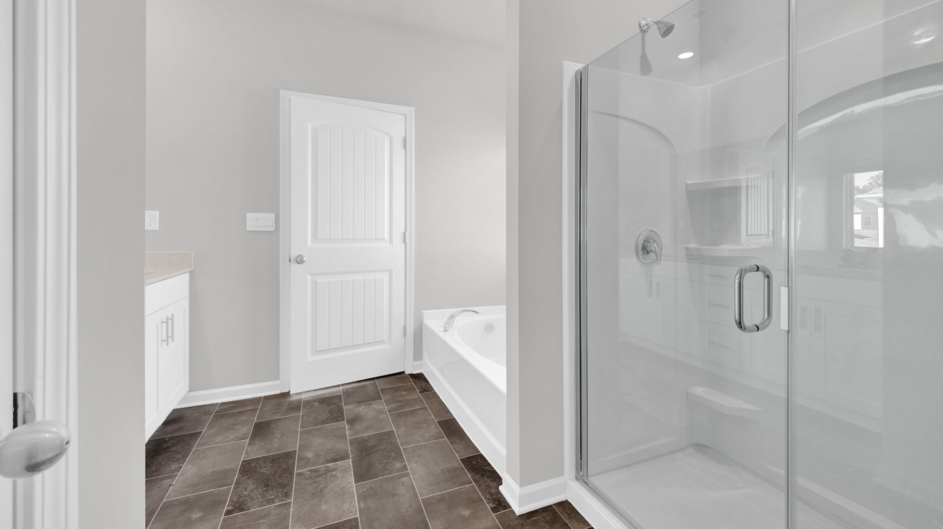 EN suite primary bathroom with a glass enclosed walk in shower