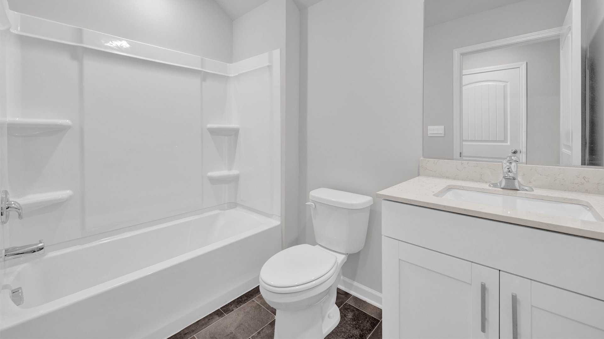 Third bathroom on the second floor with a single vanity and an acrylic tub/shower insert