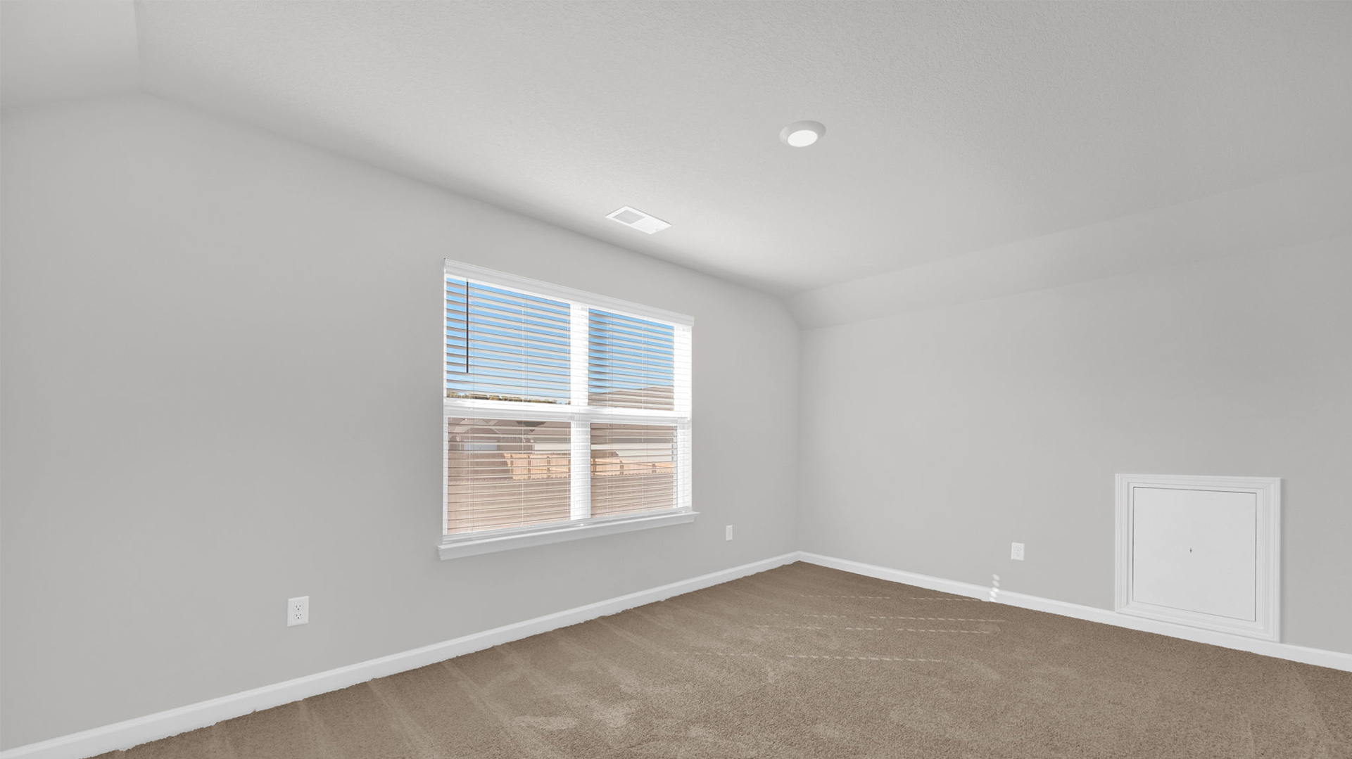 Fourth bedroom on the second floor, with a large double window for natural light