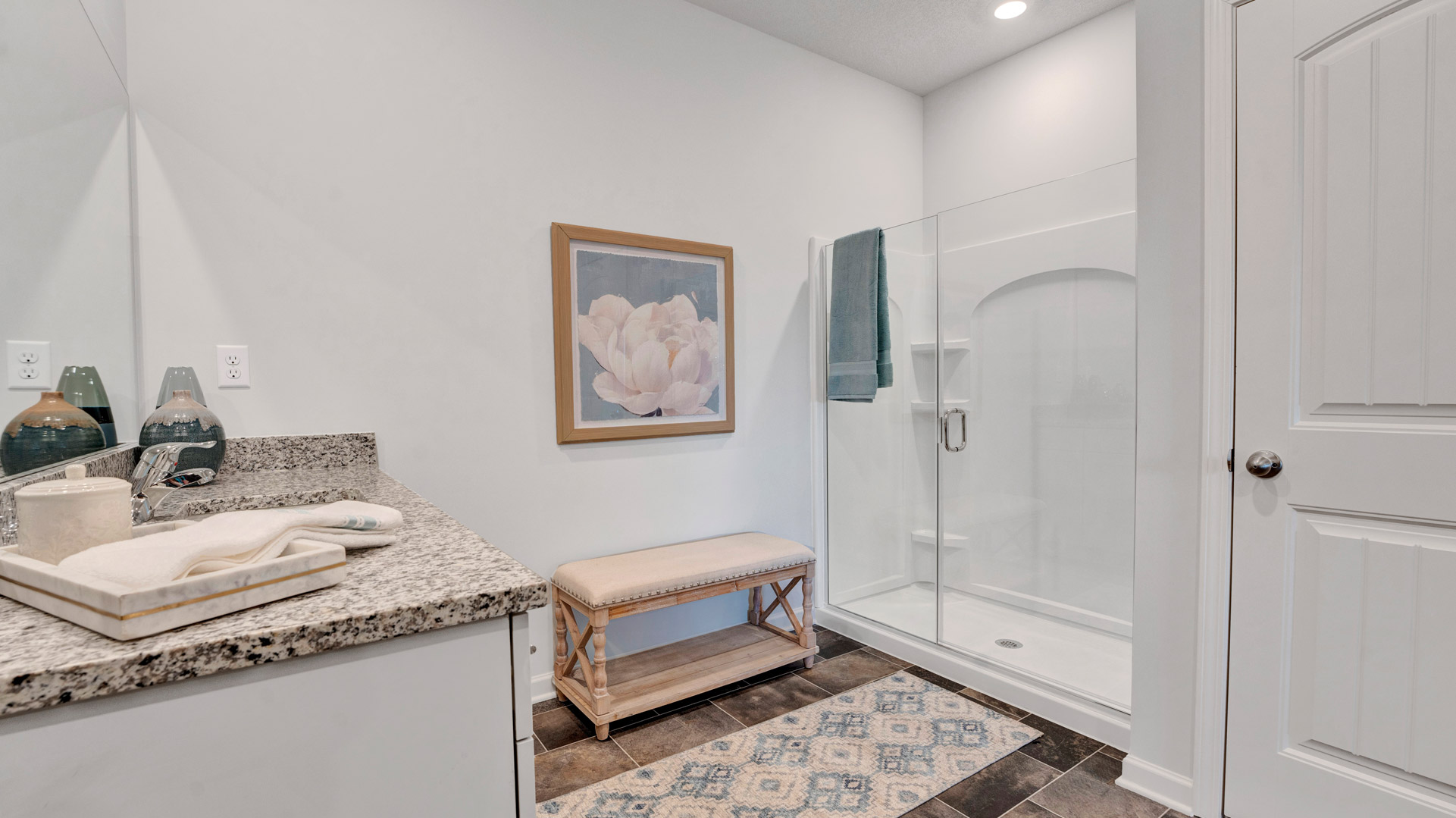 Owner’s ensuite in a new build home offers function and style with a walk-in closet, spa-like ensuite