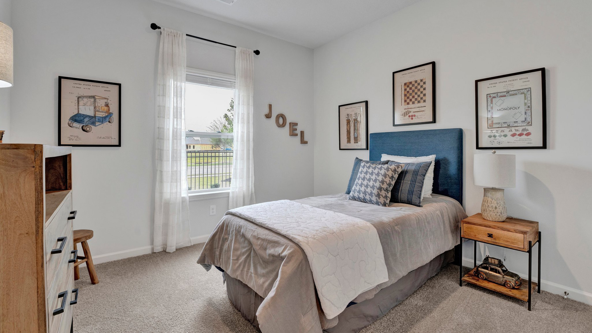 Third bedroom with carpet flooring and neutral paint