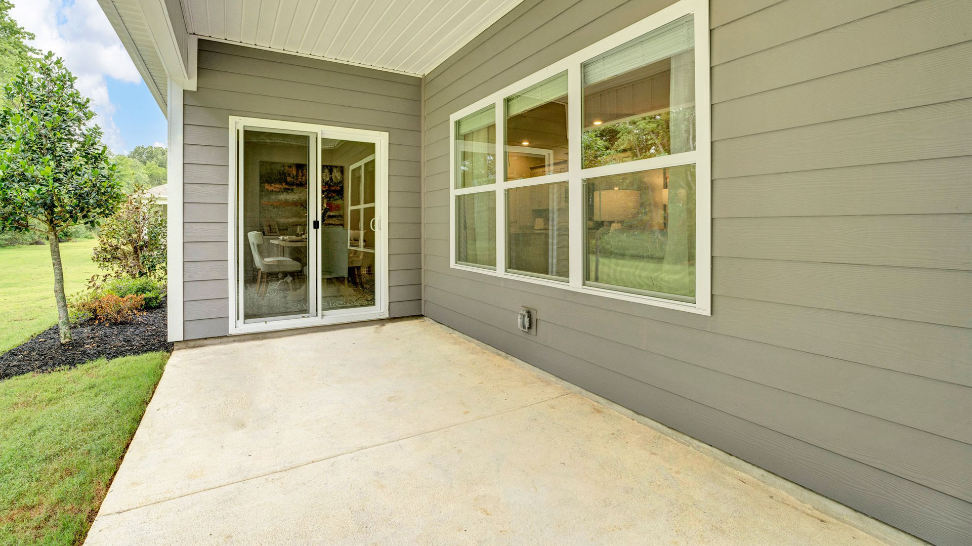 Sliding door with covered patio.