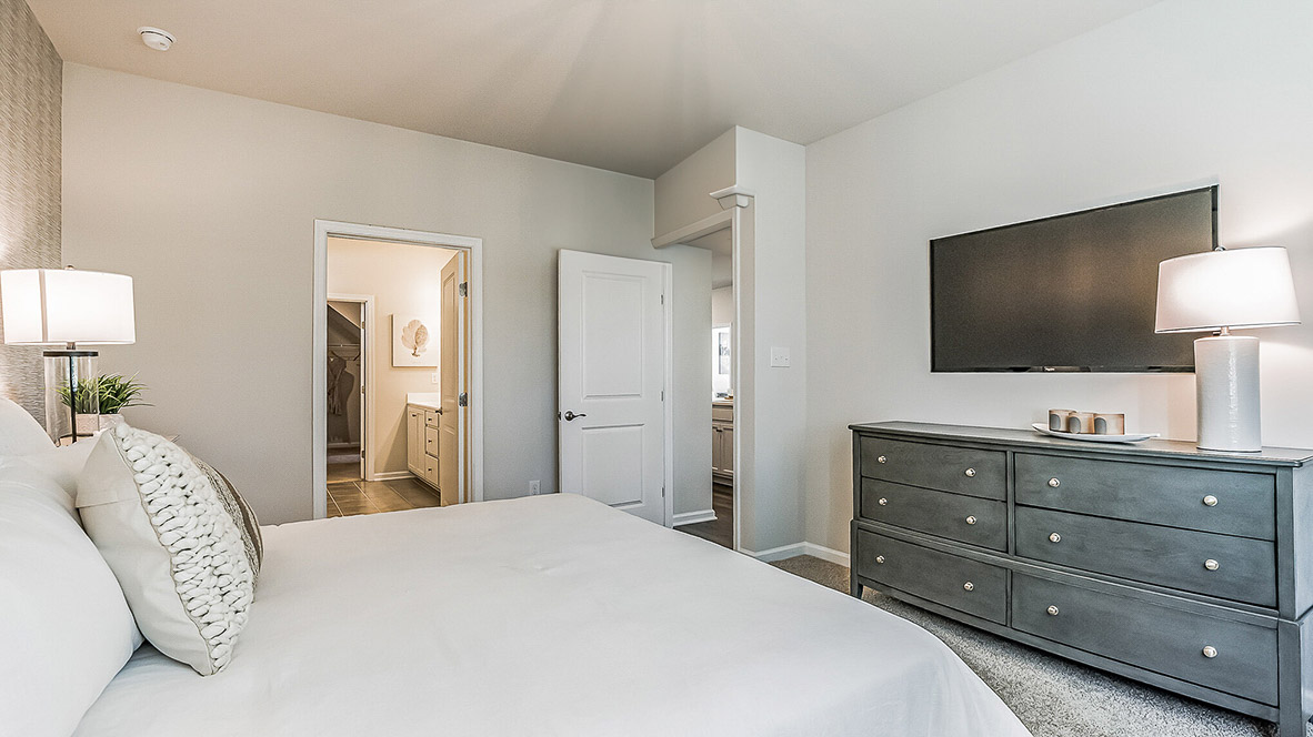 Primary bedroom comfortably fitting a king size bed